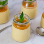 Jars with panna cotta on the table.