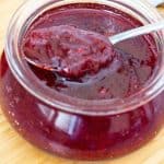 close up of the strawberry jam in a jar.