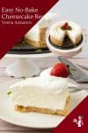 A slice of cheesecake on a plate, with the remaining cheesecake on a cake stand.