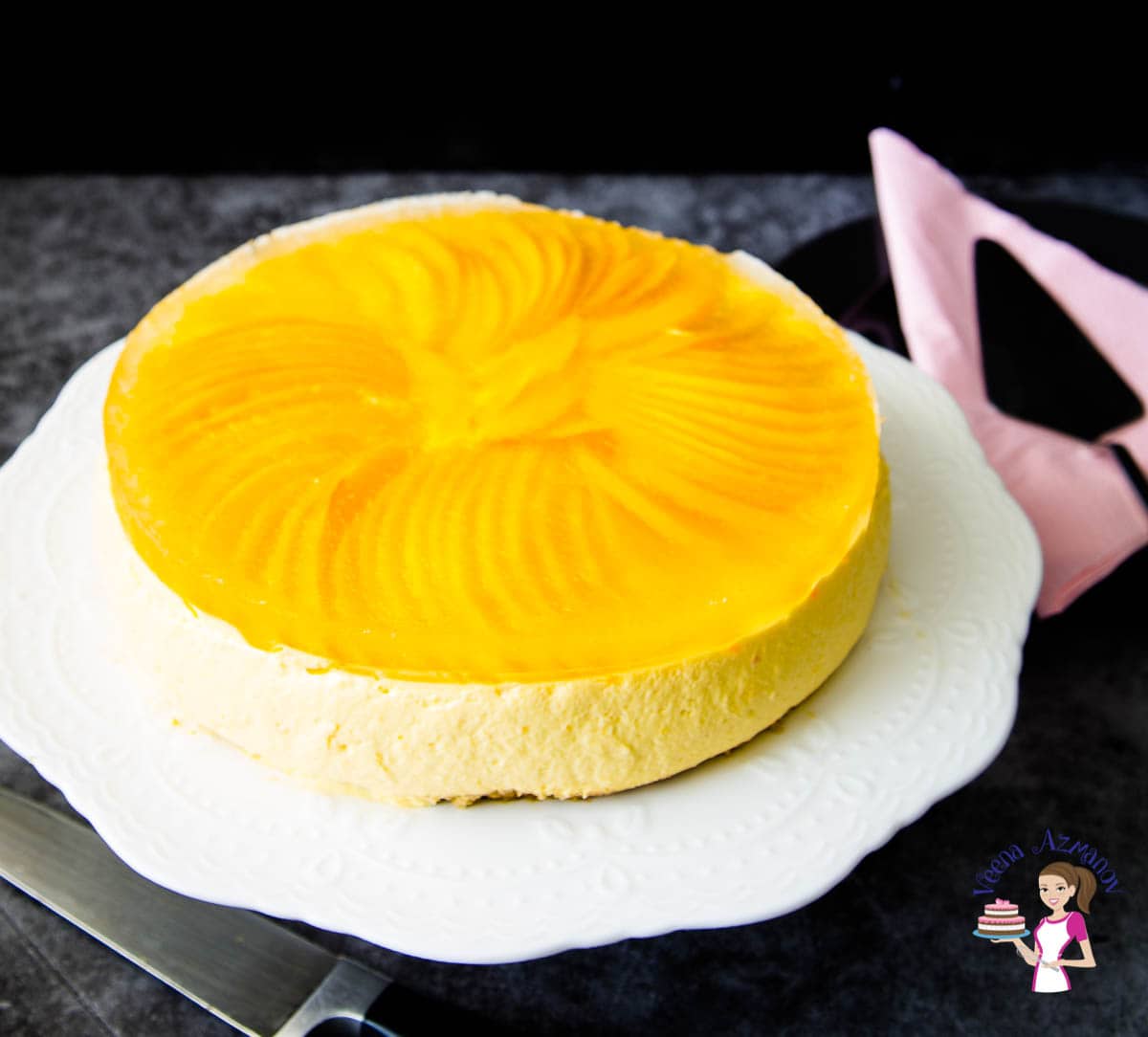 Mango cheesecake on a cake stand.