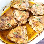 A baking dish with cajun spiced chicken.