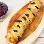 A braided puff pastry with frangipane and jam.