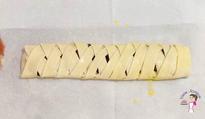 Brush the braided pastry with egg wash