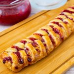 A baked pastry with strawberry puff pastry.