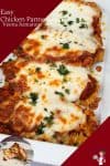 Pieces of chicken Parmesan in a serving dish.