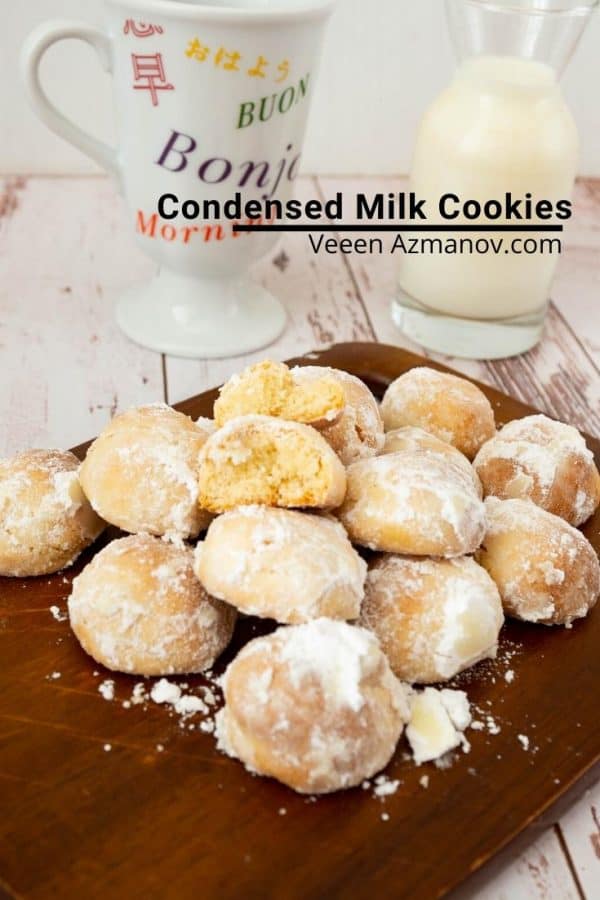 A stack of condensed milk cookies on a wooden board.
