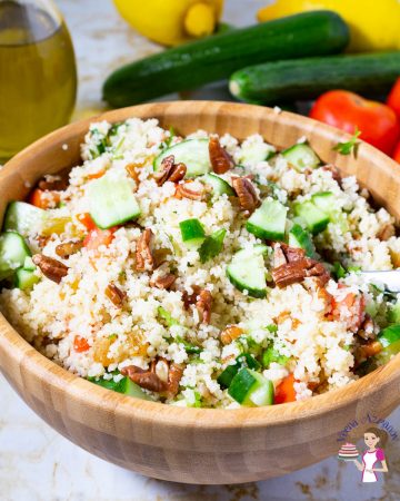 A wooden bowl with couscous salad.