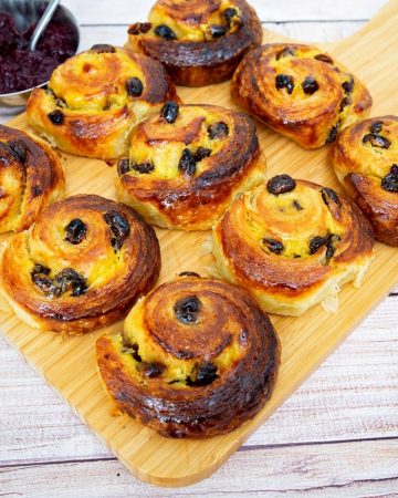 Danish pastry on a wooden board.