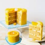 A sliced mango cake on the table.