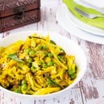 A bowl of cabbage and peas.