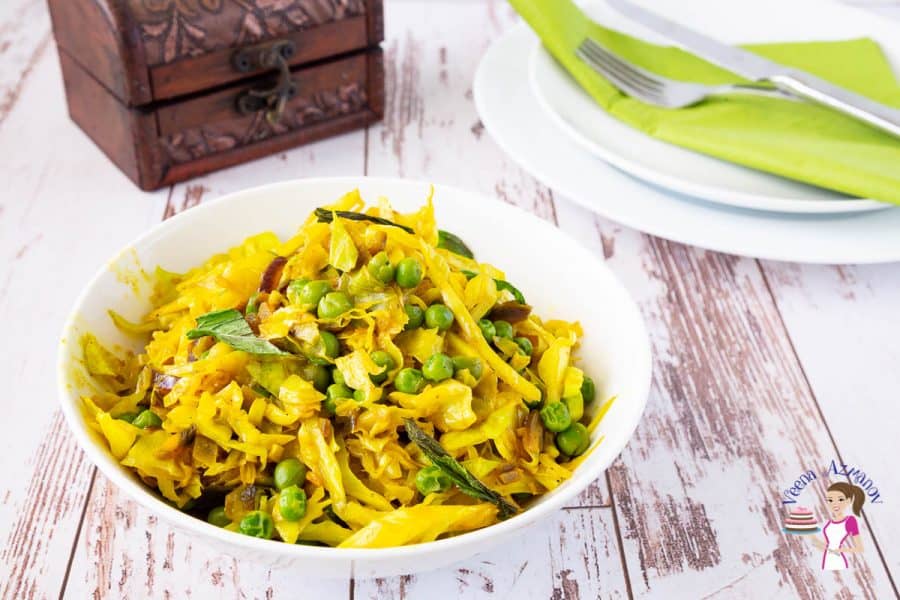 A bowl of cabbage and peas.