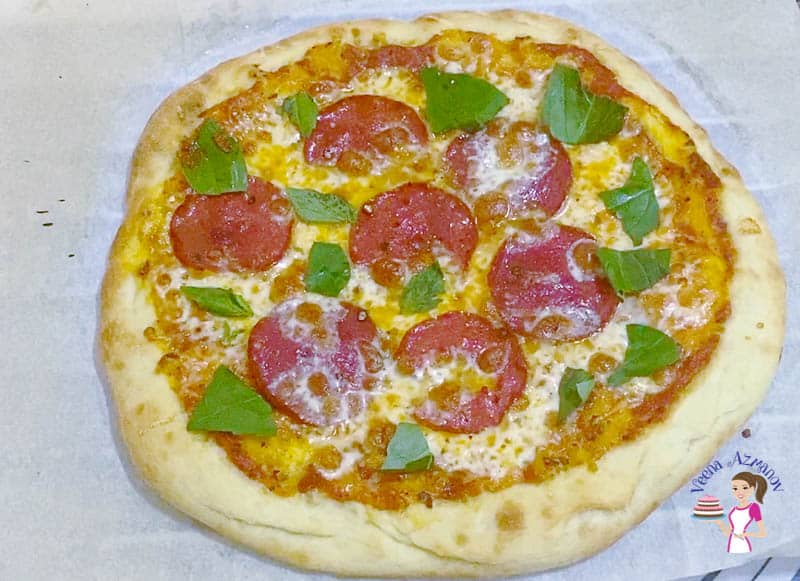 Add fresh basil on top of the pizza