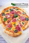 Sliced pepperoni pizza on a wooden tray.