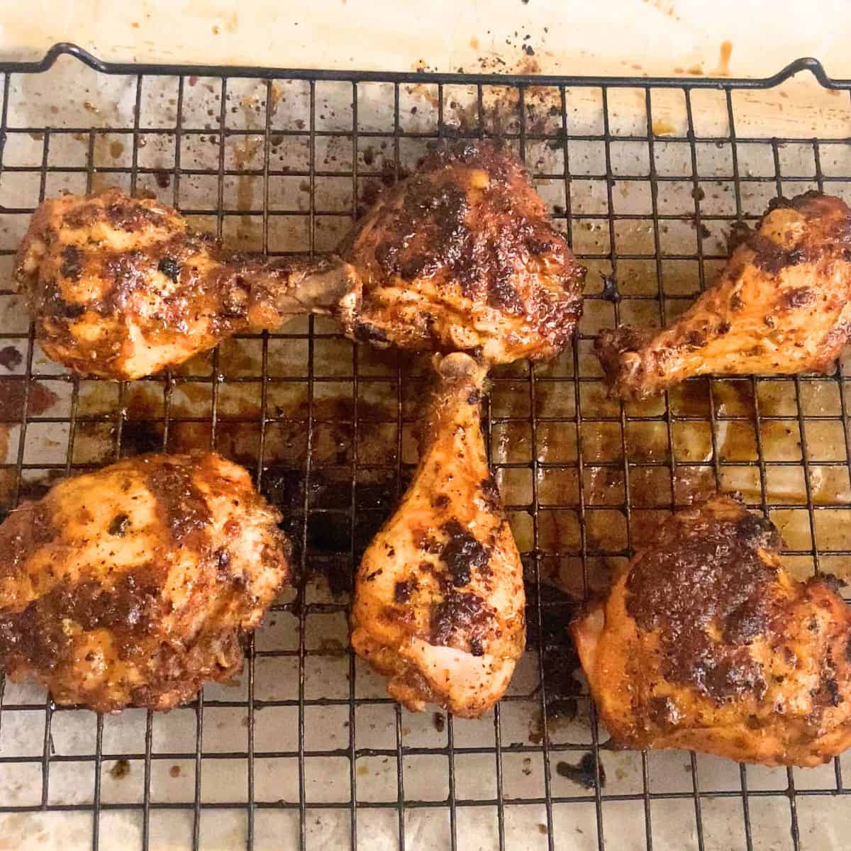 Wire rack with baked chicken.