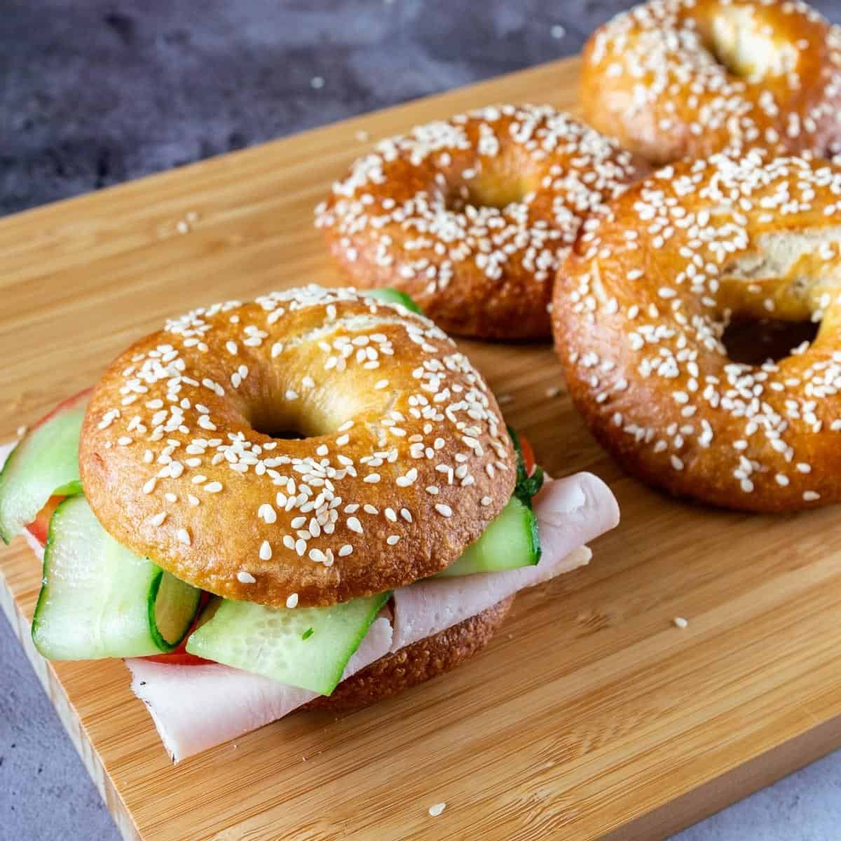 Bagels sandwich on a table.