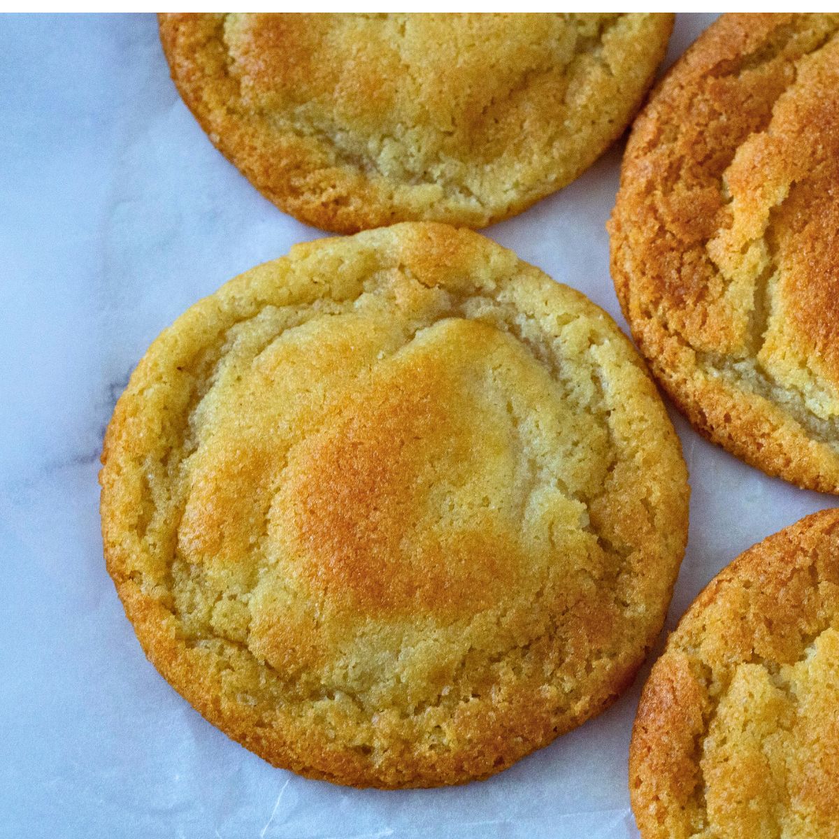 Soft chewy condensed milk cookies on the tray.