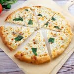 A sliced pizza on the table.
