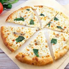 A sliced pizza on the table.
