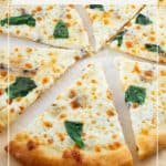 A sliced pizza on the table.