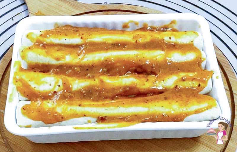 Place the enchiladas in a baking dish for baking.