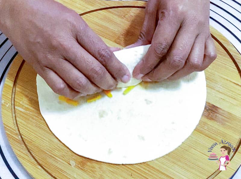 Fill the tortillas with beef and cheese for enchiladas