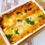 Baked enchiladas in a pan.