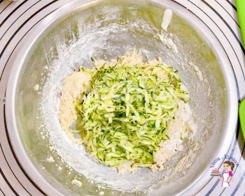 Add the grated zucchini to the muffin batter