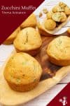 Zucchini muffins on a wooden tray.