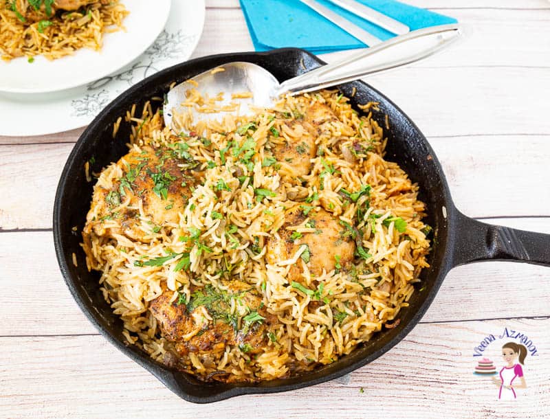 A skillet with chicken and rice.