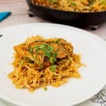 A plate with cajun spiced and rice.