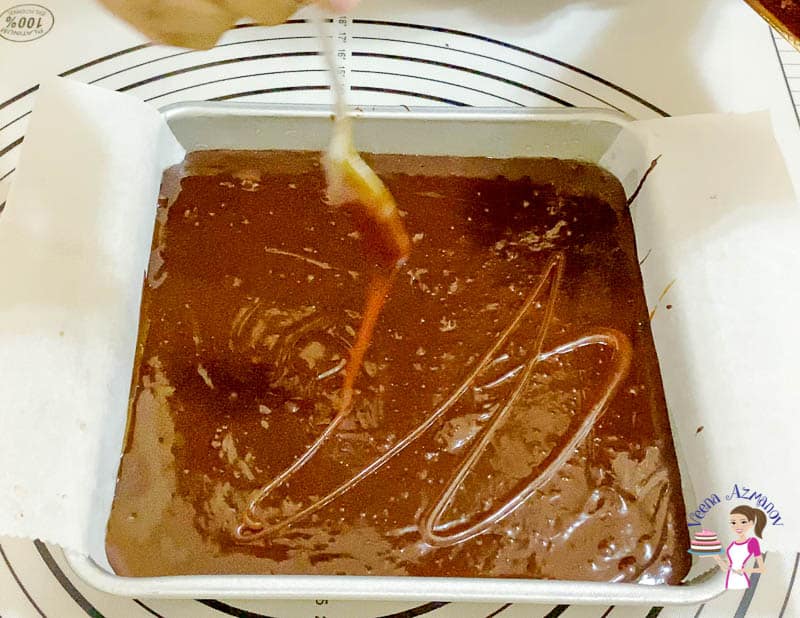 Drizzle some caramel sauce on the brownie batter