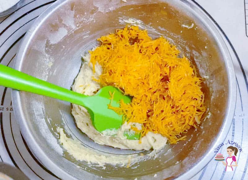 Add the grated carrots to the muffin batter