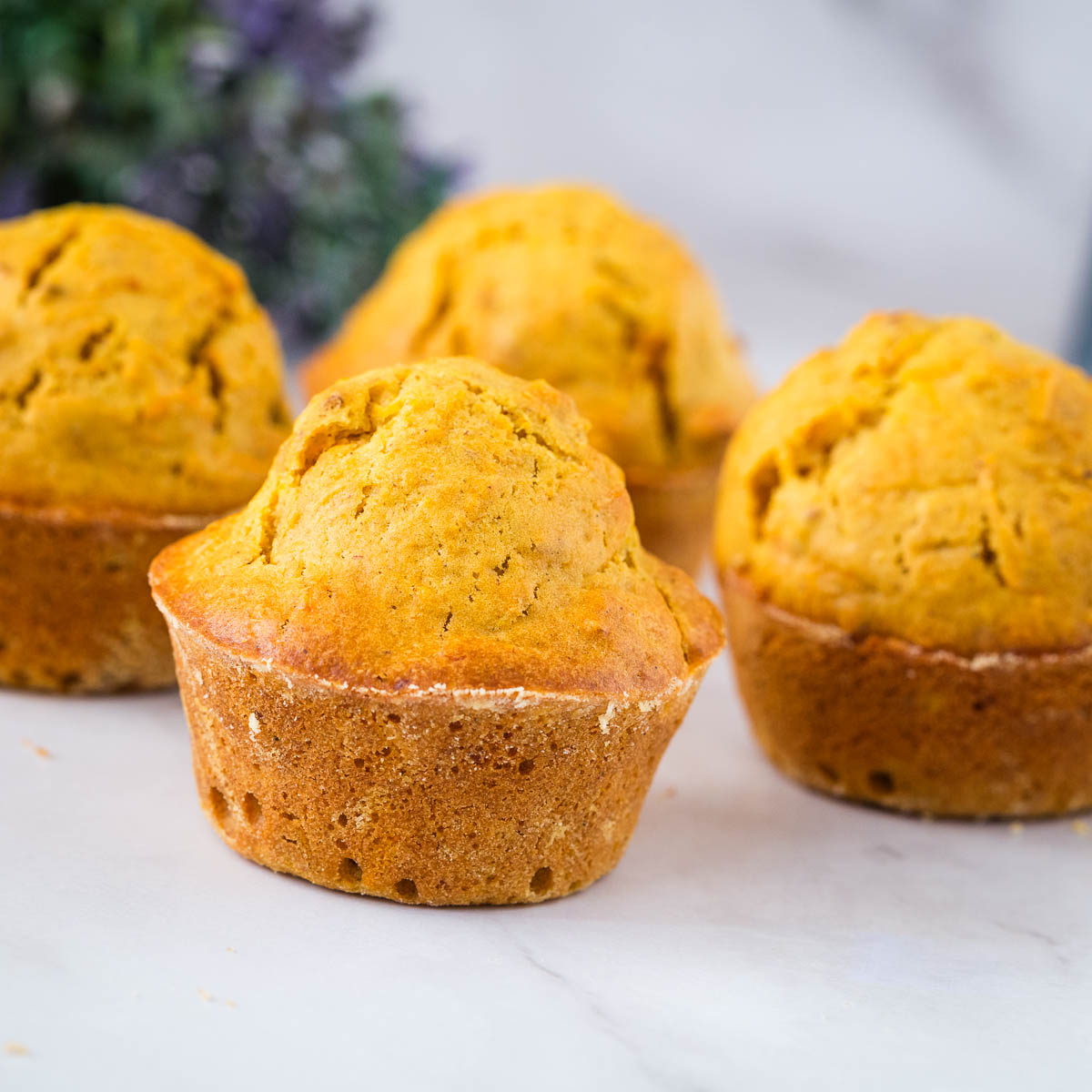 Baked carrot cake muffins on the table.