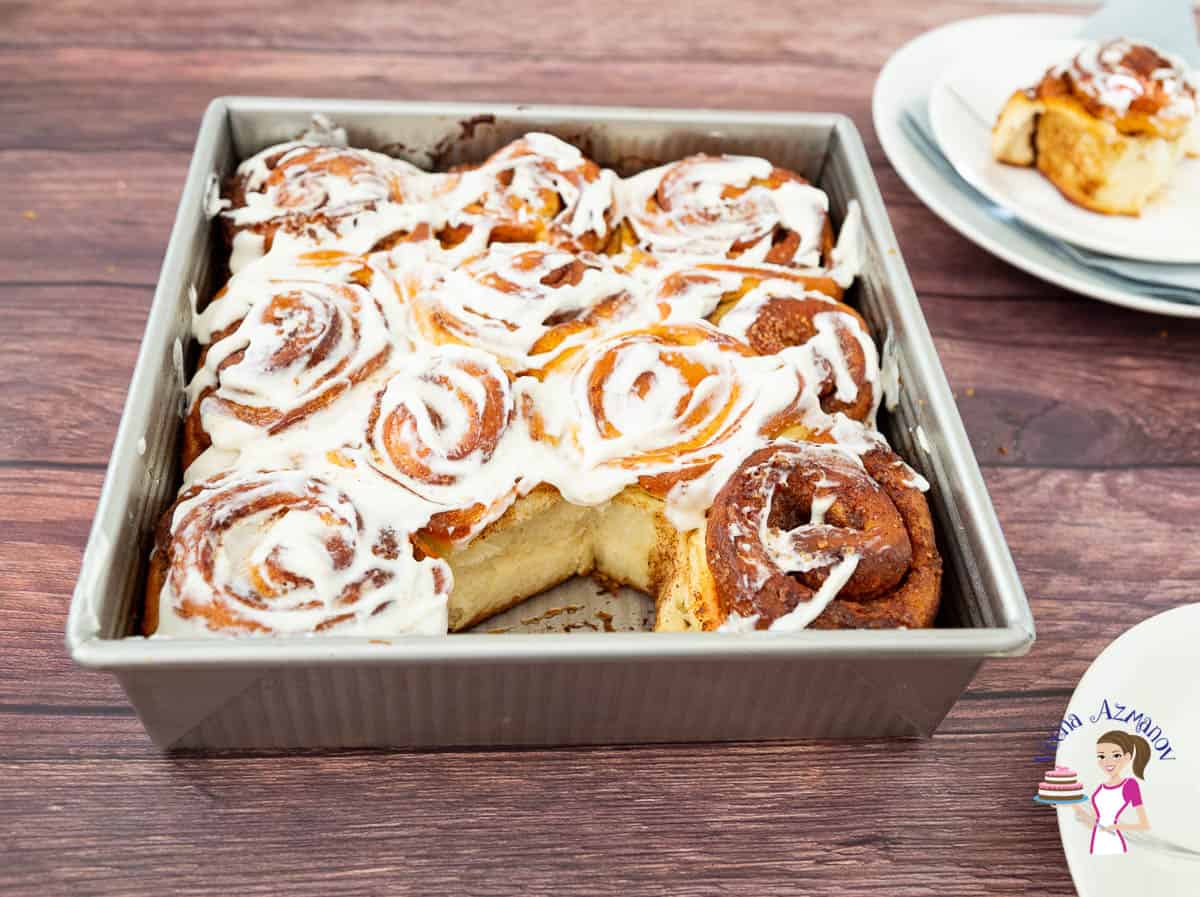 Cinnamon rolls in a square baking tray.