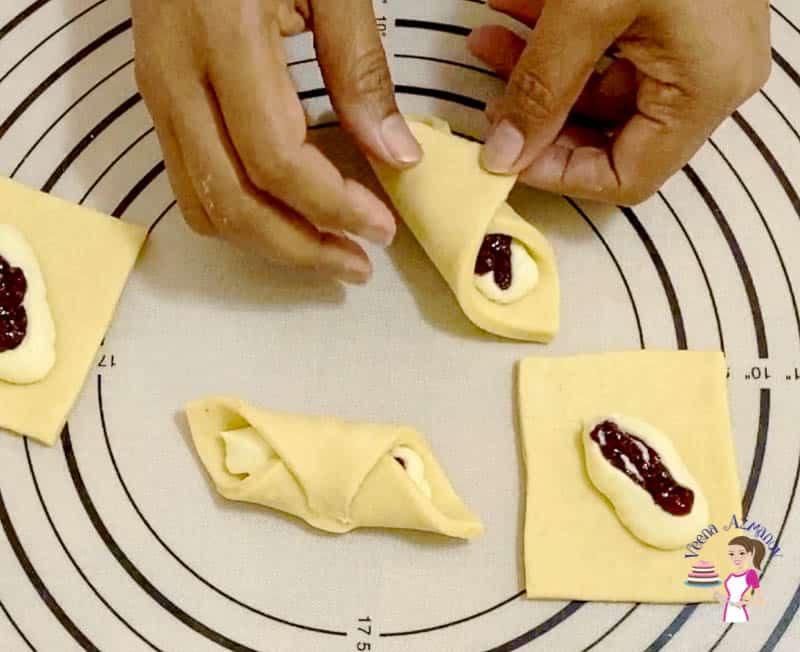 Fold the danish dough squares into a cylinder shape