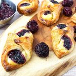 Danish pastry on a wooden board.