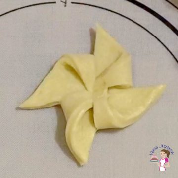 Shaping the danish pastry into pinwheels
