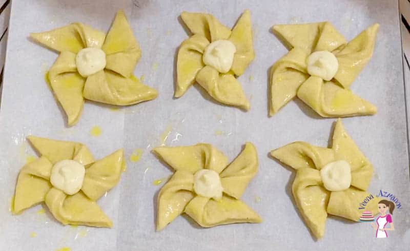 Top each pinwheel with cream cheese and jam