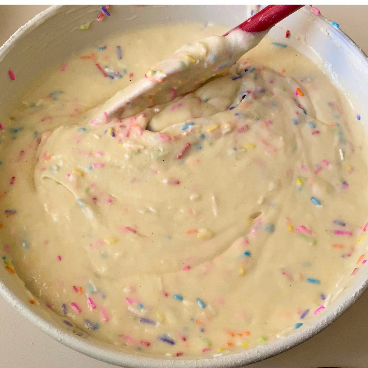 A funfetti cake batter in a bowl.