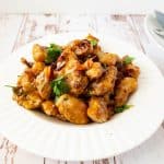 A shallow bowl with Tso Chicken.