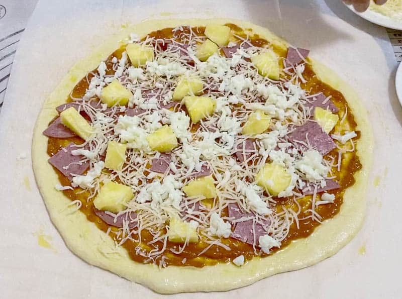 Sprinkle the cheese over the pineapple and ham