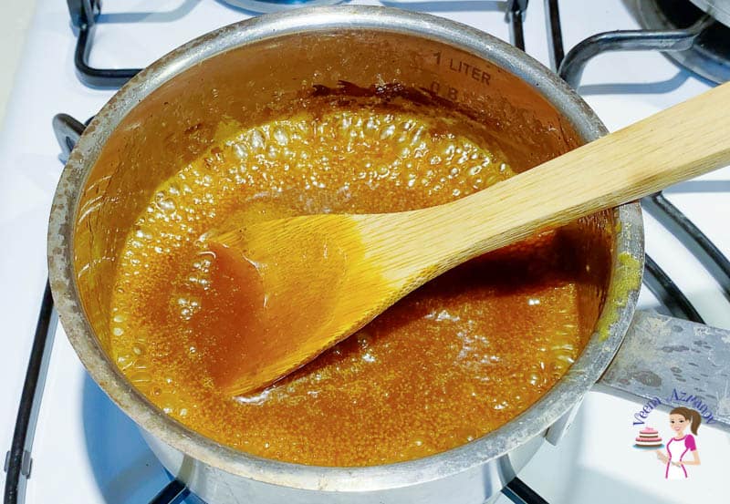 Cook the caramel until thick.