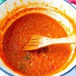 A Dutch oven pot with Marinara Sauce with Fresh Tomatoes.