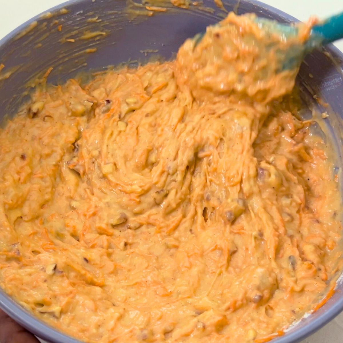 Progress pictures carrot cake batter on the table.