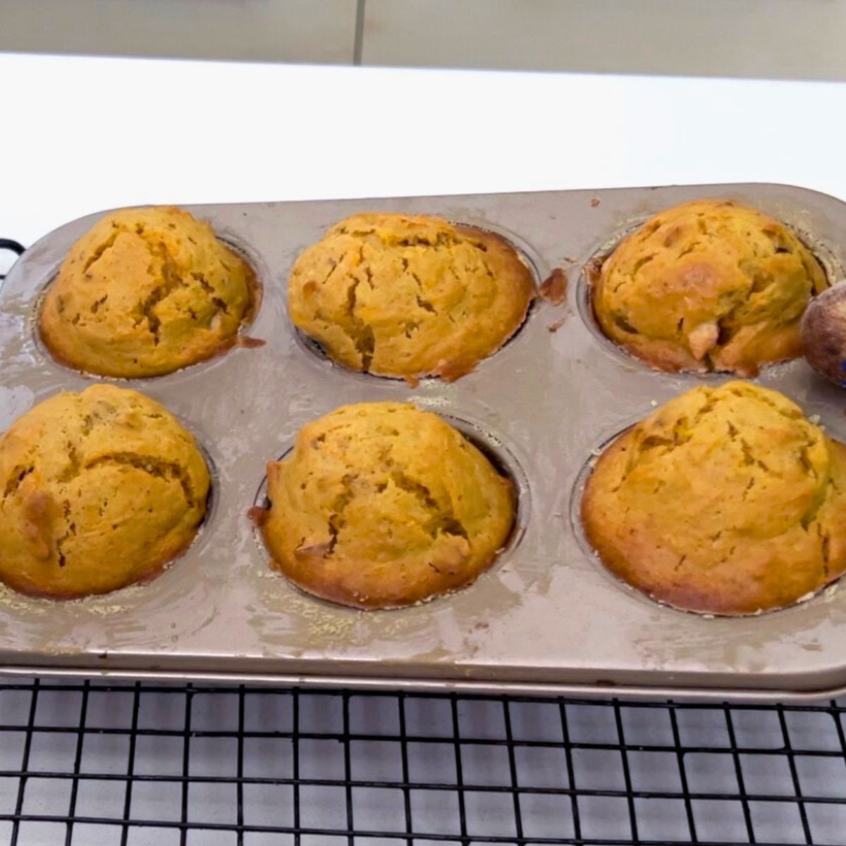 A baking tray with muffins in cake pan.