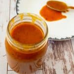 A jar with enchilada sauce.