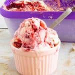 A bowl with scoops of ice cream.