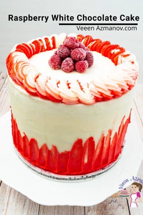A raspberry cake on a cake stand.