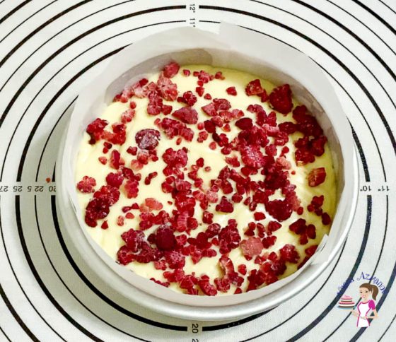 Sprinkle the raspberries over the cake batter