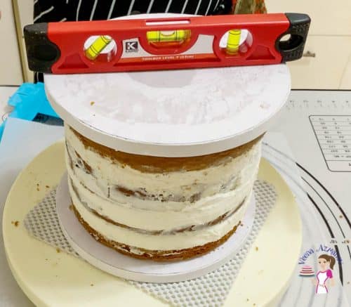 A leveler on top of a layer cake.